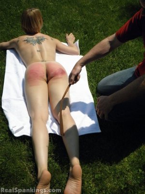 Real Spankings - Lily Strapped For Sunbathing Naked - image 3